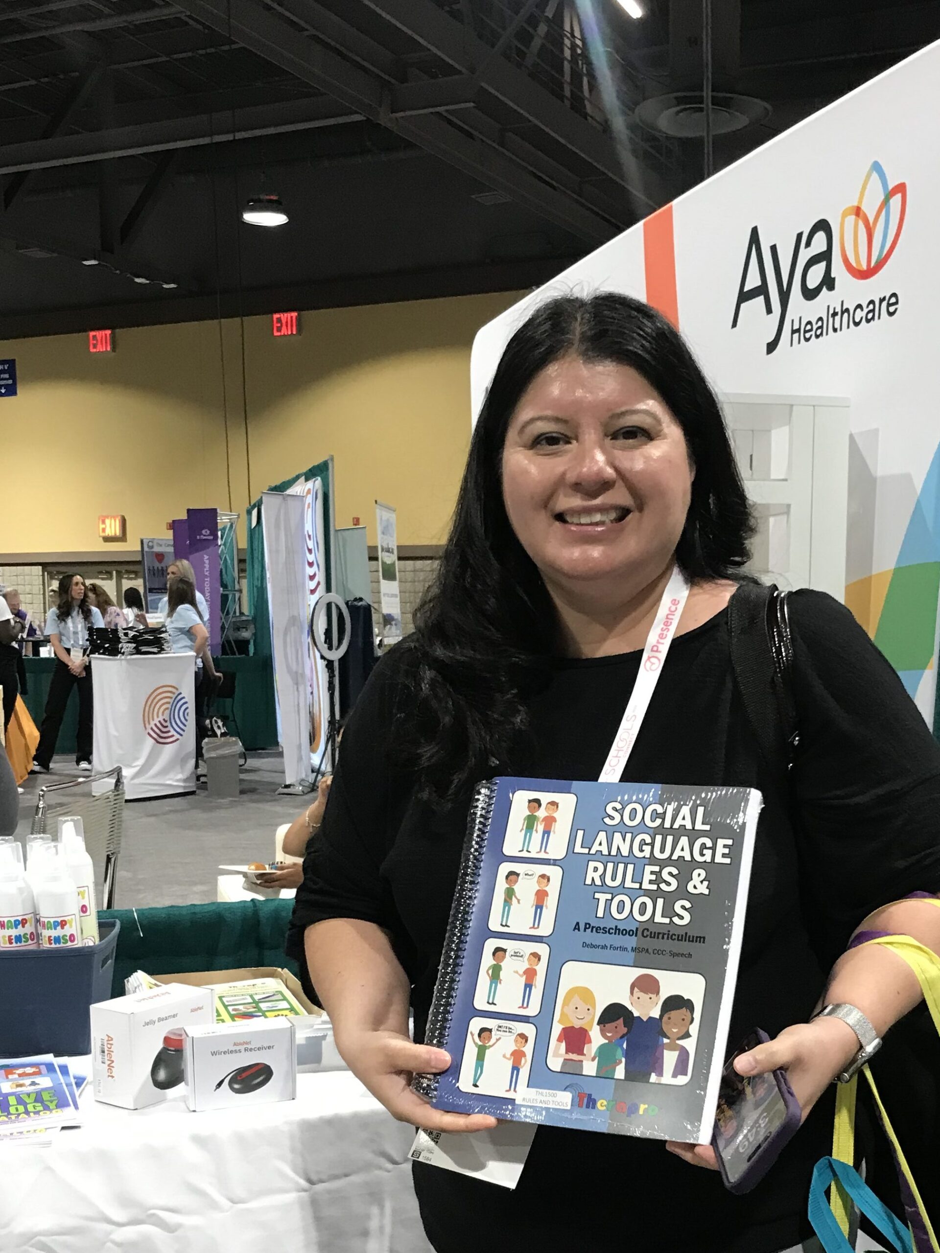 picture of woman holding the book social language rules and tools