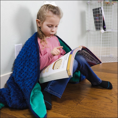 Soft Fleece Weighted Sensory Blanket used in a Sensory-friendly learning environment